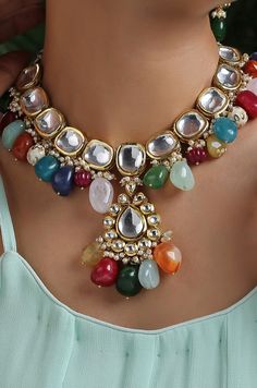 This navrattan necklace set with its pop of colors and quirky shapes is a sublime piece. The subtelty of the polki with hints of muted golden tones creates the perfect balance to create a winning look. Necklace Closure - Adjustable Dori Earrings Closure - Push Back Style Tip - This multicolored piece of art is perfect for gracing traditional funtions in full pomp and show. Navrattan itself being the traditional epitome of prosperity, wealth and status. What could be better than Handcrafted in Ja Traditional Colorful Jewelry For Festivals, Multicolor Necklaces For Festivals And Celebrations, Festive Multicolor Beaded Jewelry, Multicolor Handmade Kundan Necklace For Party, Handmade Multicolor Kundan Necklace For Party, Handmade Multicolor Temple Jewelry Necklaces, Multicolor Temple Jewelry Necklace As Gift, Multicolor Temple Jewelry Necklace For Gift, Multicolor Temple Jewelry Necklaces For Gift