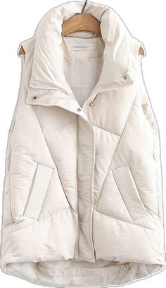 Beige Cotton Vest Outerwear, Sleeveless Solid Outerwear With Pockets, Winter Cotton Sleeveless Vest, Cotton Puffer Vest, Sleeveless Cotton Puffer Outerwear, Sleeveless Vest For Winter Cold Weather, Winter Sleeveless Vest For Cold Weather, Sleeveless Vest For Cold Weather And Winter, Winter Cold Weather Sleeveless Vest