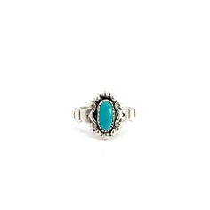 A turquoise solitaire ring. Set in the center of the ring in a bezel setting is an oval cabochon turquoise. There is a stylized scroll design around the bezel. The ring has a split style shank. This ring is a size 4 3/4.  This ring cannot be sized by our goldsmith. Stone Information Type: Turquoise Metal Content Guaranteed sterling silver Weight: 1.94 grams Measurements of Ring 7/16 inches wide at top (12mm) 1/8 inches off finger (3mm) 2.3mm wide shank at bottom Markings "Sterling" Manufacturer Vintage Oval Cabochon Turquoise Ring, Vintage Oval Turquoise Cabochon Ring, Oval Turquoise Ring With Bezel Setting, Adjustable Turquoise Oval Cabochon Ring, Southwest Fashion, Solitaire Ring Set, Silver Turquoise Ring, Sterling Silver Rings Turquoise, Turquoise Ring Silver