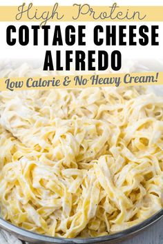 a bowl full of cottage cheese alfredo with text overlay that reads high protein cottage cheese alfredo