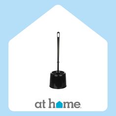 a black object sitting on top of a blue and white sign that says at home