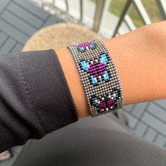 a person wearing a bracelet on their arm