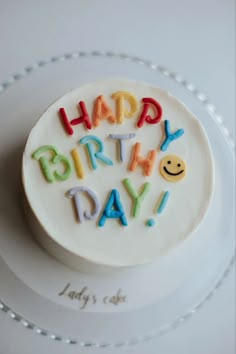 a birthday cake with the words happy birthday written on it