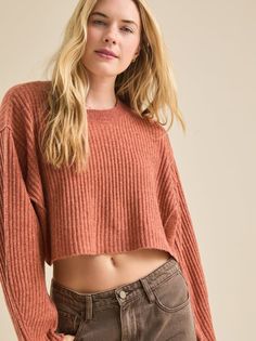 Stay cozy and stylish in this ribbed dolman pullover sweater. The cropped hemline adds a modern touch to this classic piece, perfect for layering or wearing on its own. Cozy Ribbed Cropped Sweater In Relaxed Fit, Trendy Cropped Sweater For Fall Layering, Chic Ribbed Cropped Sweater For Fall, Cozy Cropped Sweater With Ribbed Neckline For Layering, Fall Ribbed Crew Neck Cropped Sweater, Oversized Ribbed Cropped Sweater For Layering, Oversized Cozy Cropped Sweater With Ribbed Neckline, Cozy Oversized Cropped Sweater With Ribbed Neckline, Oversized Cropped Sweater With Ribbed Neckline