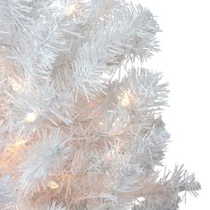 a white christmas tree is lit up and ready to be used for decorating it