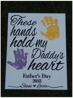 there is a sign that says these hands hold my daddy's heart father's day 2013