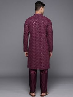 Burgundy embroidered Kurta with TrousersKurta design:Ethnic motifs embroideredStraight shapeRegular styleMandarin collar, long regular sleeves2 pockets chikankari detailKnee length with straight hemGeorgette machine weave fabricTrousers design:Solid TrousersPartially elasticated waistbandHook and eye closure