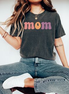 "Comfort Colors Mom T-shirt, Retro Mom Shirt, Personalized Mom Tee Shirt, Custom Mama Shirt, Mother's DAy T-shirt, Gift for Mama https://toptrendtshirtsus.etsy.com NOTE: Please contact me for more size,color, product (sweatshirt, hoodies,kids etc) options. I'm always here to help. Unisex Garment-Dyed T-shirt Comfort Colors® 1717 *Medium fabric (6.1 oz/yd² (206.8 g/m *Relaxed fit *Sewn-in twill label *100% ring-spun cotton About Comfort Colors introduces its garment-dyed t-shirt; a fully customiz Cute Relaxed Fit T-shirt As Gift, Cute Multicolor Relaxed Fit T-shirt, Relaxed Fit Cotton T-shirt As Gift, Multicolor Graphic Tee T-shirt As Gift, Fun Graphic Print Shirt For Mother's Day, Multicolor Letter Print Tops With Relaxed Fit, Family Matching Soft-washed Short Sleeve T-shirt, Multicolor T-shirt For Mother's Day Gift, Trendy Tops With Funny Text For Mother's Day