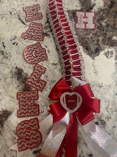 two red and white ribbons with the words happy valentine's day written on them