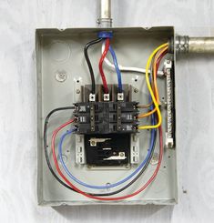 an electrical box with multiple wires connected to it