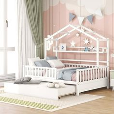 a child's bedroom with pink walls, white furniture and stars on the ceiling