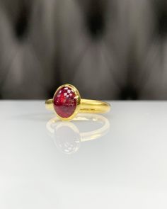 Natural Ruby Ring * Dainty Cabachon Ring * Genuine Ruby & 14K Solid Gold * Best Gift for Her/Him * Handmade Ring ◎ Details ◎ ○ Gemstone Details .Natural RUBY (GLASS FILLED) Oval Cut 9X7 mm approx. 2.00 ct ○ Gold Details 14K Solid Gold Width of Band : 2.50 mm Weight of Ring : approx 3.80 gr Made to Order HANDMADE ITEM ○ Upgrade to Solid 18K Gold, please click the link below: https://www.etsy.com/listing/962826004 For more CABACHON BEZEL rings : http://etsy.me/37fvI60 All of our jewelleries ar Domed Sapphire Ring As A Gift, Gold Ruby Ring With Domed Shape, Gold Domed Ruby Ring With Gemstone, Gold Ruby Ring Oval Cabochon With Polished Finish, Classic Domed Ruby Ring As Gift, Classic Domed Ruby Ring Gift, Gold Ruby Ring With Cabochon In 14k Gold, Gold Ruby Ring With Polished Round Band, Gold Ruby Ring With Polished Finish