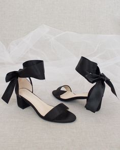 Classy satin block heel with satin ribbon ankle tie. Simple yet¬†elegant¬†are¬†great combination and will definitely be a favorite.DETAILS:HEEL HEIGHT: 1.25 inches (kids) & 2 inches (women)RIBBON WIDTH: 1.5 inchesUPPER: Synthetic upper and liningMATERIALS: Manmade outsoleORIGIN: Imported Small Heel Shoes Black, Black Heels For Wedding Bridesmaid, Shoes For Black Prom Dress, Fun Black Heels, Black Bridesmaids Shoes, Black Ribbon Heels, Prom Shoes Small Heel, Black Heels Small Heel, Small Heels For Prom