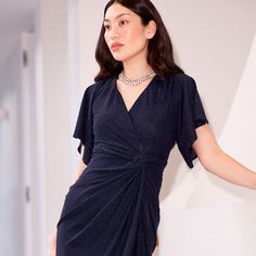 A signature Sacha Drake style, the Emporium Dress in Navy is a classic events dress that stands the test of time. Uber flattering with the knotted detail adding a drape over the tummy, the fluted cap sleeve adds coverage and the stretch metallic jersey fabric creates the ideal hourglass silhouette.   Luxurious stretch lurex jersey fabric to flatter the figure in all the right places  Fluted cap sleeve for added arm coverage  V-neckline to suit all bust sizes Lined with stretch jersey for added c Drake Style, Hourglass Silhouette, June Birthstone Jewelry, Gifts For New Mums, Jewelry Ring Box, Pearl Jewellery Earrings, Evil Eye Jewelry, Eye Jewelry, June Birth Stone