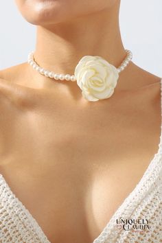 Introducing our Rose Bud Pearl Choker – the perfect accessory to add a touch of glamour to any outfit! This exquisite Rose Bud Pearl Choker features a goldtone 3-inch extender, lobster clasp closure, and a delicately satin-finish rosette. Whether you're accessorizing for a special occasion or enhancing your daily ensemble, this one-of-a-kind piece is sure to make a timeless statement. Elegant Rose Jewelry For Spring, Spring Formal Rose Gold Jewelry, Rose Bud, Pearl Choker, Affordable Luxury, Rose Buds, Front Design, Satin Finish, Chain Link