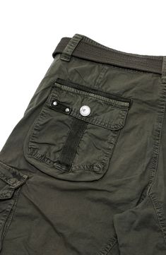 Plenty of pockets trim modern cotton cargos that includes woven belt details that complete the look. 11" rise, 11" inseam (size 32) Zip fly with button closure and belt detail Dual side slant pockets, 4 side flap pockets 100% cotton Machine wash Imported Model stats: 6'1" height, 32" waist. Model is wearing size M Casual Cargo Shorts For Outdoor With Belt Loops, Utility Bottoms With Flap Pockets, Utility Short Cargo Jeans With Multiple Pockets, Short Utility Cargo Jeans With Multiple Pockets, Utility Style Short Cargo Jeans With Pockets, Outdoor Khaki Cargo Shorts With Belt Loops, Utility Cargo Shorts Jeans With Pockets, Khaki Cargo Shorts With Belt Loops For Outdoor, Utility Shorts With Belt Loops