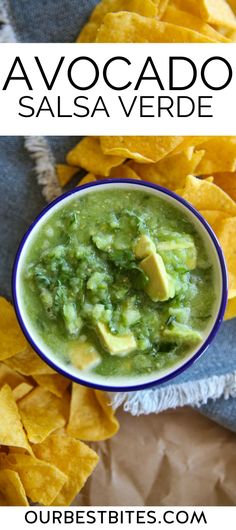 a bowl of guacamole with tortilla chips on the side