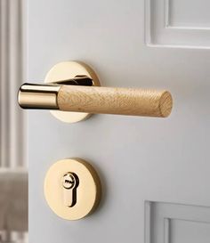 a door handle with a wooden stick on it