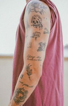 a man with tattoos on his arm and shoulder