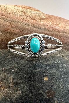 Vintage Navajo Sterling Silver Sleeping Beauty Turquoise Cuff Bracelet 6.75" Orders totaling $100 and up include an anti-tarnish treated velvet jewelry pouch!  Inside circumference including opening measures approximately 6.75" and is slightly adjustable  Opening measures approximately 1.5"  Across laying flat at widest point measures approximately 2.5" Width in front measures approximately 1" Weighs approximately 20 grams Condition: Pre-owned Metal: Sterling Silver No stamp, electronically test Western Turquoise Bangle Cuff Bracelet, Western Style Turquoise Bangle Cuff Bracelet, Adjustable Southwestern Turquoise Cuff Bracelet, Adjustable Turquoise Southwestern Cuff Bracelet, Turquoise Concho Bohemian Cuff Bracelet, Bohemian Turquoise Cuff Bracelet With Concho, Bohemian Turquoise Concho Cuff Bracelet, Turquoise Bohemian Cuff Bracelet With Concho, Handmade Turquoise Western Cuff Bracelet