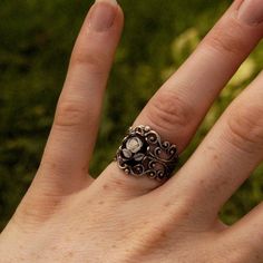 Victorian style antiqued adjustable filigree ring.At its center is a 10x8mm black and white rose cameo.This ring is adjustable to most sizes. Available in antiqued silver or bronze as well as other cameo colors. Each ring comes in a gift box. Zodiac Rings, Cameo Ring, Ring Sale, Minerals And Gemstones, Filigree Ring, Green Rose, Pink Ring, Fantasy Jewelry, Blue Rose