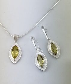 Silver Lemon Quartz Pendant & Drop Earrings Hammered Finish Jewellery Set. Lavan Designer Jewellery.UK Each piece of jewellery is handcrafted in our Buckinghamshire (UK) based studio using traditional techniques and the latest technology. Since 1993, the designer, David Weinberger has been designing and handcrafting unique contemporary collections of  fine gold and silver jewellery set with precious gemstones and opals. All jewellery is made with hypoallergenic sterling silver, and includes our Artisan Yellow Teardrop Jewelry, Traditional Yellow Jewelry With Gemstone, Traditional Yellow Gemstone Jewelry, Traditional Oval Yellow Jewelry, Traditional Yellow Teardrop Jewelry, Traditional Yellow Oval Jewelry, Pendant Earrings Set, Gem Earrings, Silver Jewellery Sets