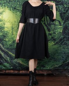 A timeless and ever-flattering classic, our Black Cotton Puff Sleeve Chemise makes the perfect dress to wear on it's own, under a corset, or accessorized with your favorite renaissance faire accessories. This dress is made from super soft 100% textured cotton fabric, featuring puff sleeves and an optional on or off the shoulder silhouette. Adjustable ties above the elbow create two voluminous puffs in the sleeves, and an elastic neckline keeps our chemise snug and fitted around your shoulders and arms. This listing is for the black dress only, other items in these photos can be purchased separately from our shop. Elegant Fitted Corset Dress For Larp, Elegant Corset Dress For Larp, Medieval Style Dress For Costume Party, Peasant Dresses For Larp, Peasant Dresses For Medieval Festivals, Spring Medieval Fitted Dress, Fitted Medieval Summer Dress, Fitted Medieval Style Summer Dress, Fitted Medieval Dress For Summer