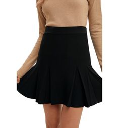 The Tessa Pleated Mini Skirt is a stylish blend of sophistication and ease. Crafted from a rib knit fabric, it offers a comfortable fit with just the right amount of stretch. The pleated design adds movement and texture, giving this classic black skirt a polished yet playful vibe. Perfect for both casual outings and more elevated looks, the Tessa skirt is a versatile wardrobe staple that can be dressed up or down with ease. Fabric Content: 55% Viscose 45% Silk Solid Color Stretch Mini Pleated Skirt, Elegant Non-stretch Pleated Flared Skirt, Elegant Non-stretch Flared Pleated Skirt, Elegant Pleated Hem Tennis Skirt, Elegant Stretch Tennis Skirt For Spring, Elegant Mini Tennis Skirt, Chic Accordion Pleats Mini Skirt For Fall, Casual Stretch Skirt With Accordion Pleats, Elegant Skort With Pleated Flared Skirt