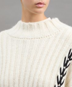 Hand-knit alpaca-blend maxi sweater with contrasting graphic edges. The turtleneck and ribbed weave give this piece an elegant look, while the woven details along the sleeves add a distinctive and refined touch. Slightly wide sleeves for a touch of modernity and comfort. Perfect for a casual chic look, it can be paired with jeans or dress trousers for a versatile and trendy outfit. The special workmanship makes this creation an exclusive piece in Peuterey's entire winter season collection. TurtleneckHandcrafted decorationWide sleevesAlpaca blend Maxi Sweater, Short Puffer Jacket, Long Puffer Jacket, Teen Shopping, Knit Alpaca, Elegant Look, Sweater For Women, Trendy Outfit, Outerwear Outfit