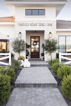 the front entrance to twenty eight zero one, which is located in a white brick building