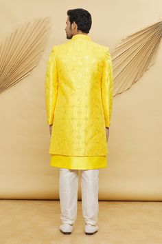 Yellow front open longline jacket with sequin and floral embroidery. Paired with kurta and aligarhi pant.
Component: 3
Pattern: Embroidered
Type Of Work: Floral and Sequin
Neckline: Jacket: Open
Sleeve Type: Jacket: Full Sleeves
Fabric: Art Silk, Dupion Art Silk
Color: Yellow
Other Details: 
Sequin work
Embroidered jacket
Occasion: Wedding - Aza Fashions Indian Groom Dress, Kurta Set For Men, Longline Jacket, Indian Groom, Open Sleeve, Sequin Jacket, Yellow Art, Fashion App, Embroidered Jacket