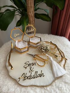 a table topped with gold and white items