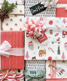 presents wrapped in christmas wrapping paper and tied with bows, candy canes and pine cones