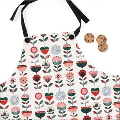 an apron with flowers and cookies on it