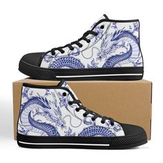 These Blue Dragon Blue Ceramic Black high top canvas shoes are ideal for being unique and standing out from the rest of the crowd. To be Gnarly, you need to be different and feel different. These shoes will help you express yourself through the intricate art and gnarly design it displays. This unique shoe is hand drawn/designed in the USA and built with fantastic quality. CONSTRUCTION: Our shoes are very well constructed with quality stitching and a solid base. They are comfortable and durable and suitable for most occasions. HANDCRAFTED DESIGN: Wearing these shoes is making a statement. Our shoes have bold and gnarly designs that fit anyone who want to separate themselves from the rest. The designs are inspired by art and beauty from around the world. Exclusively designed in the USA. __FE Blue High-top Canvas Shoes, Blue Canvas High-top Sneakers For Streetwear, Blue Canvas High-top Sneakers With Round Toe, Blue Casual Canvas Custom Sneakers, Casual Blue Canvas Custom Sneakers, Dragon Blue, Unique Shoe, Black High Top Converse, Intricate Art