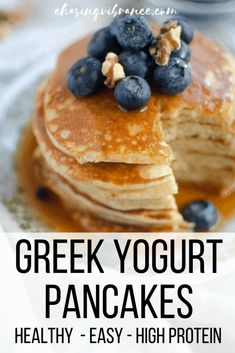 greek yogurt pancakes on a plate with blueberries and syrup in the background