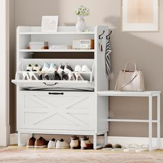 a white shoe rack with shoes on it and a handbag sitting next to it