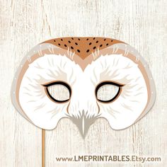 an owl mask is shown on a white wooden background with the words printables easy