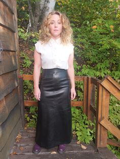 Vintage 1990's made in Canada 100% genuine black leather skirt.  Wonderful soft leather with a zipper closure and flattering fit.  Waist measures 29 inches. Measured flat and in inches. Waist - 14.5 in Hips - 20.5 in Length - 40 in Long Black Leather Skirt, Maxi Skirt For Fall, Leather Maxi Skirt, Skirt For Fall, Black Leather Skirt, Leder Outfits, China Dress, Black Leather Skirts, Skirt Leather