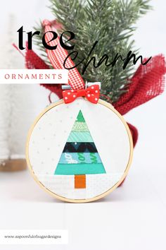 a christmas tree ornament hanging from a red ribbon with the words free pattern on it