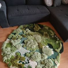 a living room with a couch and rug on the floor