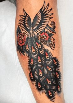 a close up of a person's leg with a tattoo design on the thigh