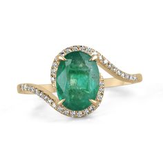 A beautiful, oval emerald and diamond ladies' ring. The center gemstone features a lovely 1.65-carat, natural oval-cut emerald with remarkable qualities. Carefully prong set, with micro-pave set diamonds accenting the bypass shank. Crafted in gleaming 14K yellow gold. Setting Style: Prong/Pave Setting Material: 14K Yellow Gold Setting Weight: 2.3 Grams Main Stone: Emerald Shape: Oval Cut Weight: 1.65-Carats Clarity: Semi-Transparent Color: Lush Dark Green Luster: Good Treatments: Natural, Oiling Origin: Zambia Secondary Stone: Diamond Weight: 0.15-Carats (Total) Cut: Round Clarity: VS Color: H Luster: Excellent Treatments: Natural Estimated Retail Value: $6,490.00 USD A certificate of appraisal is provided upon purchase. Keep in mind we custom create all of the items listed here. If you ha Exquisite Oval Brilliant-cut Gemstones, Exquisite Oval Brilliant Cut Gemstones, Oval Brilliant Cut Gemstones For Fine Jewelry, Exquisite Oval Emerald Ring, Oval Emerald Birthstone Ring In Fine Jewelry Style, Oval Brilliant Cut Emerald Gemstones, Exquisite Oval Gemstones With Halo Setting, Oval Green Diamond Gemstones, Fine Jewelry Oval Gemstones With Center Stone