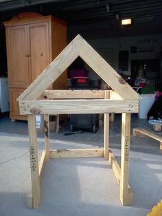 a house made out of wood sitting on the ground