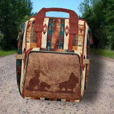 "This Western Themed Backpack features a vibrant saddle blanket & Team Roper leather detailed design which is digitally printed directly to the item. This bag can be PERSONALIZED with your name, initials, monogram, Business Logo or Your Ranch Brand - You can also order it without the personalization option if your prefer. STYLISH while still offering STRONG, STURDY construction this multipurpose backpack can be used in MANY WAYS - use it as a daily use backpack, stow-away travel carry-on bag, diaper bag and more! DEEP pockets, wide carry HANDLES - rather than a \"loop\" at the top as is common with most backpacks - These same handles also Slide Right Over the Telescoping Pull Handle of the Suitcases, Plus an insulated front pocket that will hold a freezer pack and 3 cans, or bottles. The s Multicolor Rectangular Shoulder Bag For Outdoor, Brown Tote Bag For Outdoor Activities, Multicolor Backpack Shoulder Bag For Outdoor, Multicolor Rectangular Leather Backpack For Everyday Use, Rectangular Large Capacity Backpack For Overnight Trips, Rectangular Brown Bag For Outdoor Activities, Rectangular Brown Bags For Outdoor Activities, Brown Rectangular Bag For Outdoor Activities, Brown Standard Backpack For Overnight Trips