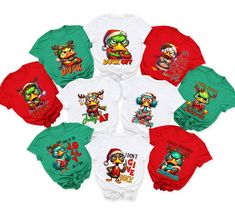 six different colored shirts with cartoon characters on the front and one is red, green, white