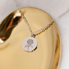 "BIRTH FLOWER NECKLACE: Flowers that won't ever lose their bloom. Makes a perfect gift, or go-to piece for yourself. This listing is for 01 necklace with one or multiple pendants. 18K Gold Plated, 18K Rose Gold Plated. -------------------------- Details: * High polished stainless steel * Disc measures 12mm x 14mm * 1.5mm Stainless Steel, 18K Gold Plated, 18K Rose Gold Plated Chain 18\" * Engraved with a high precision laser engraver, clear and easy to read. * Handmade to order, please allow 1-3 February Flower, August Flower, Tulip Necklace, Long Distance Friendship Gifts, Birth Flower Necklace, Floral Pendant Necklace, Custom Initial Necklace, Sunflower Necklace, Minimal Necklace