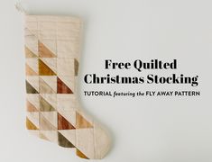 a christmas stocking with the words free quilted christmas stockings on it's side