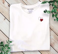 White T-Shirt Personalized Small Heart T-Shirt White Red Heart Women T-shirt Little Heart T-shirt Red Heart T-shirt Cotton Women T-Shirt ROUND COLLAR White T-shirt regular cut and breathable material. Soft and comfortable 100% cotton composition and its well-fitted cut. White Tee Shirt Woman with red heart can be a gift T-shirt for Mother's Day  A nice little set to compose according to your family. Family clothing set to be a Valentine family A nice Valentine's Day gift for women  Personalized Red T-shirt For Valentine's Day Gift, White Tops With Heart Graphic For Valentine's Day, Valentine's Day Cotton T-shirt With Heart Print, Cotton T-shirt With Heart Print For Valentine's Day, Crew Neck T-shirt With Heart Graphic As Gift, Valentine's Day Gift T-shirt With Heart Graphic, Cotton Top With Heart Graphic For Valentine's Day, Heart Print Crew Neck T-shirt For Gift, Red Heart Graphic T-shirt As Gift