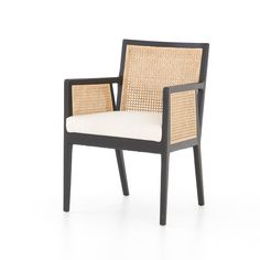 a black and white chair with wicker on the back, in front of a white background